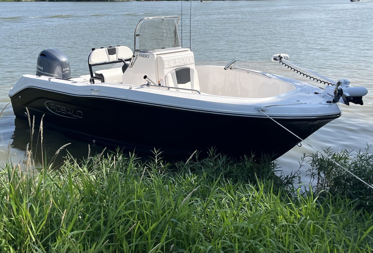 Captain Q Charters black and white Robalo R180 fishing boat with Yamaha outboard